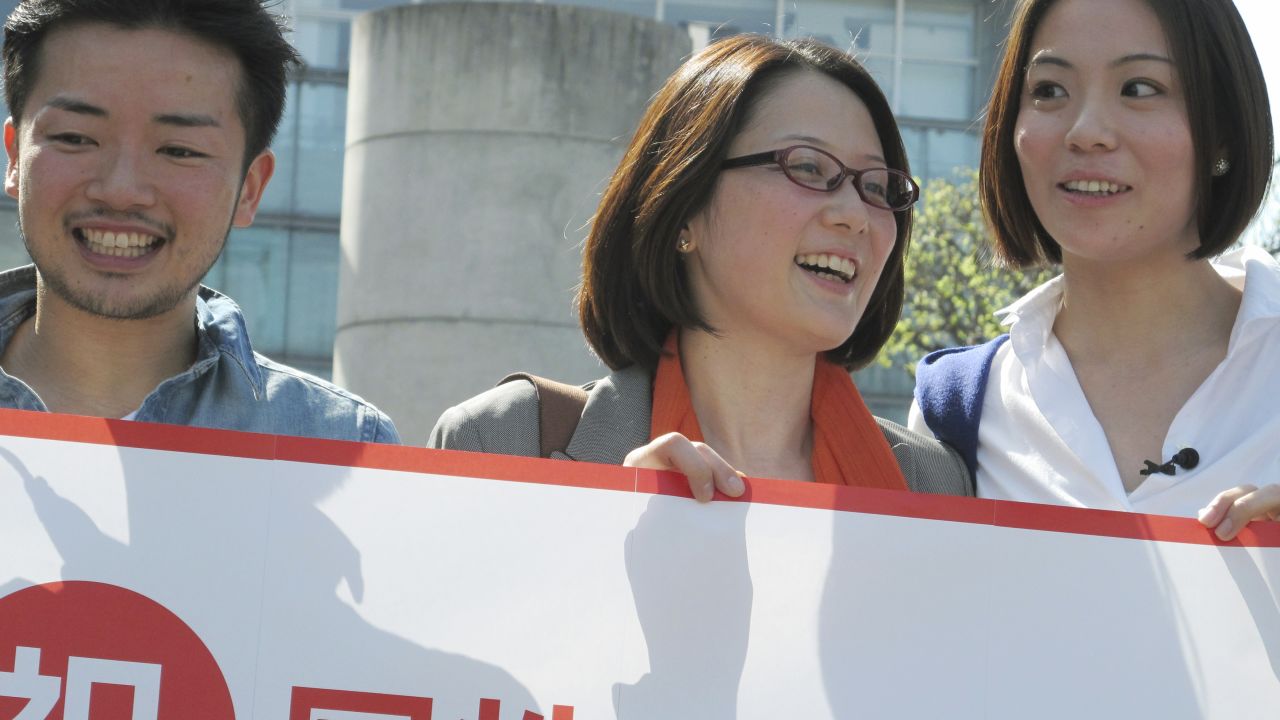 LGBT activists celebrate in front of Shibuya ward office in Tokyo Tuesday, March 31, 2015 after Shibuya ward became the first locale in Japan to recognize same sex partnerships as the "equivalent of a marriage." 