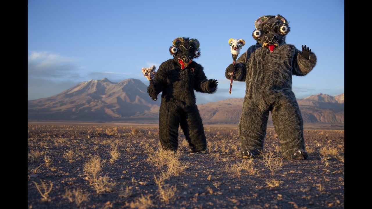 Jeannete Valenzuela and Katherine Gonzalez dress in costume for a religious festival in Ayquina, Chile, last July. Photographer Andres Figueroa spent time in the Atacama Desert chronicling festivals that attract thousands of people to otherwise quiet mining towns in Chile.