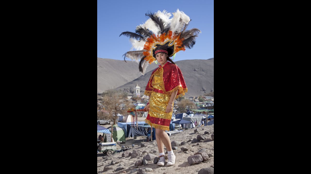 Pricila Encalada wears a colorful headdress in San Lorenzo de Tarapaca.