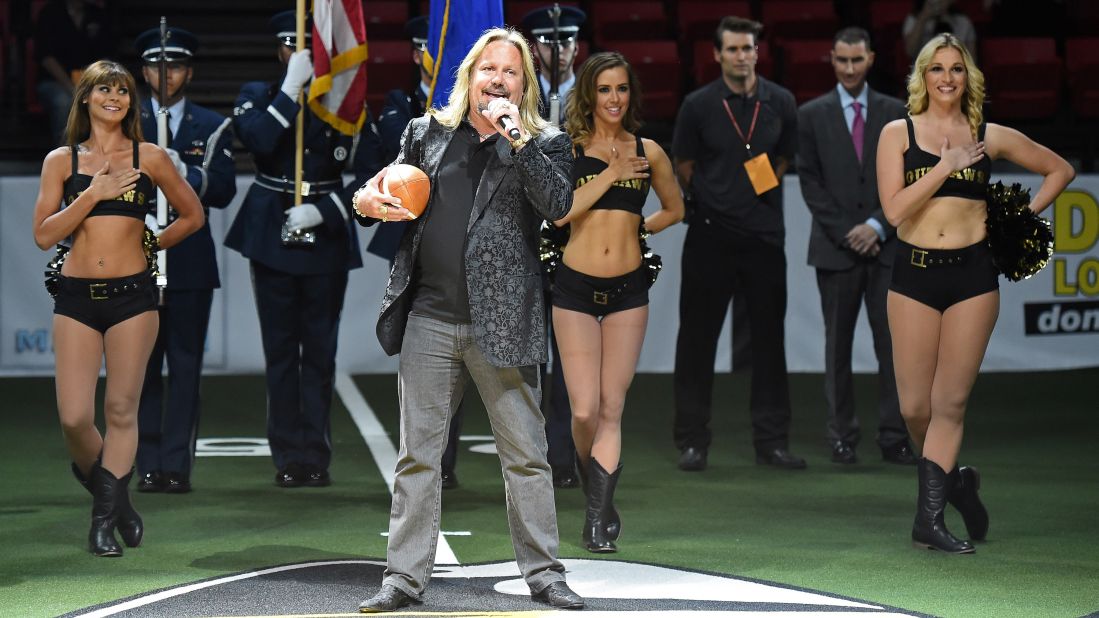 Motley Crue band member Vince Neil performs the national anthem before an arena football game between the Las Vegas Outlaws and the San Jose SaberCats on Monday, March 30, in Las Vegas. 