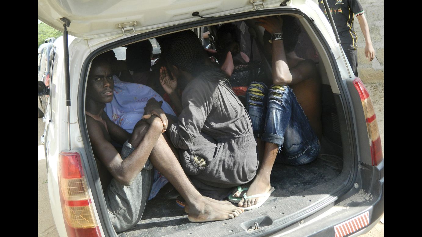 Students take shelter in a vehicle after fleeing the attack.