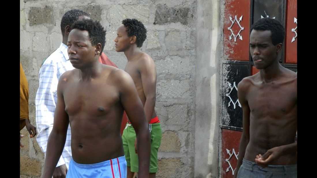 Students step out of a house in Garissa where they sought refuge after escaping the attack.