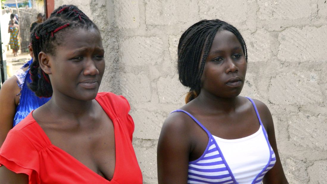 Students leave a house where they had taken shelter on April 2, 2015.