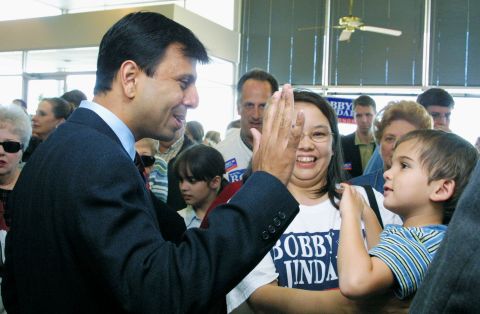While campaigning for his first gubernatorial campaign in November 2003, Jindal gets a high-five from young supporter in Shreveport.