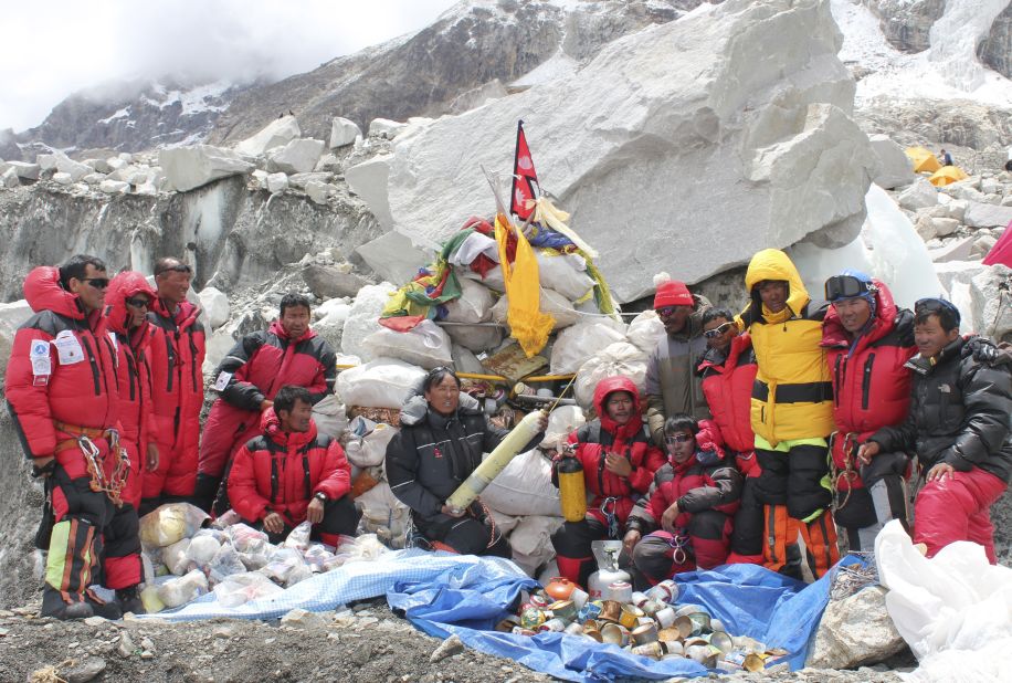 Sherpa climbers pose at Everest Base Camp after collecting garbage during the Everest cleanup expedition on May 28, 2010. A group of 20 Nepalese climbers collected nearly two tons of garbage in a high-risk expedition to clean up the world's highest peak.