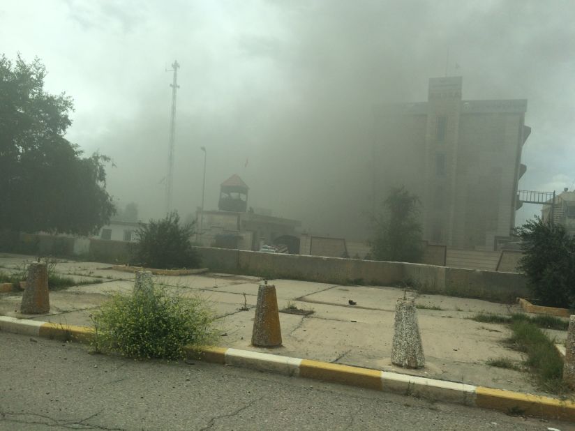 Smoke rises from a government building. As Iraqi forces, aided by Shiite militiamen, took control of Tikrit on April 1, they found vehicles laden with explosives and buildings that might be booby-trapped. 