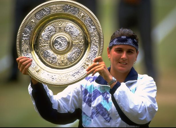 With 739 victories, Conchita Martinez of Spain is the seventh highest winner in women's tennis. Here she lifts the Wimbledon trophy in 1994.