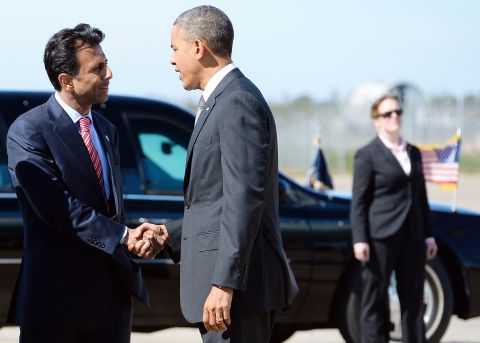 Jindal greets President Obama at Louis Armstrong International Airport in New Orleans on November 8, 2013.