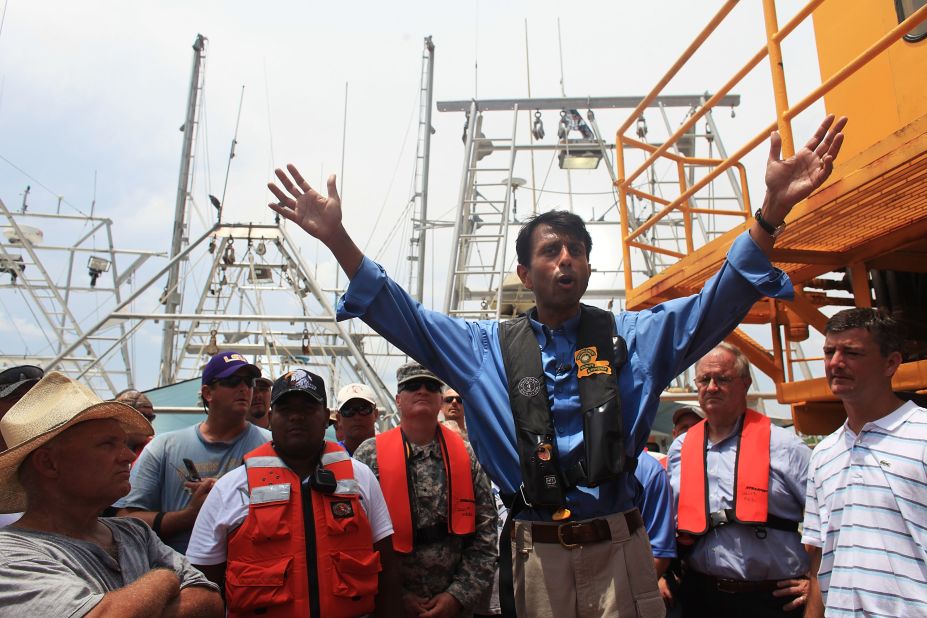 Jindal speaks with workers and fishermen involved in the cleanup effort of the BP oil spill on a command post boat in Barataria Bay on June 15, 2010, off Grand Isle, Louisiana.