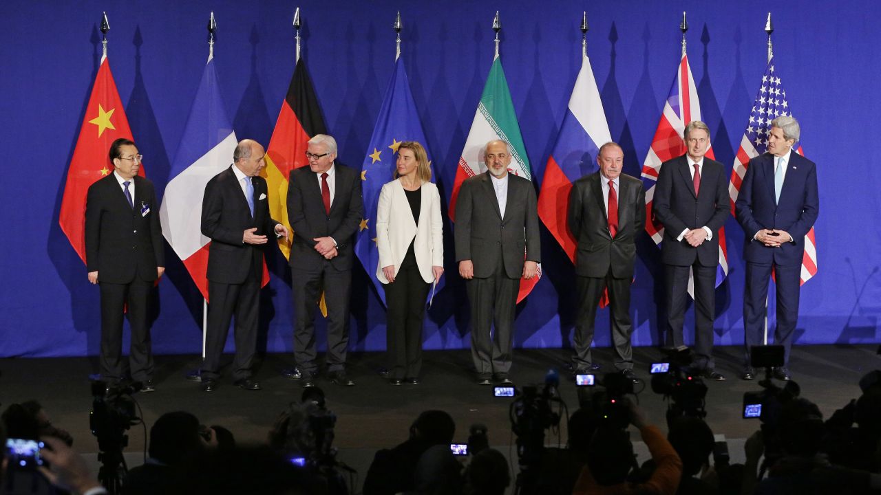 LAUSANNE, SWITZERLAND - APRIL 02: (L-R) Chinese Head of Delegation, French Foreign Minister Laurent Fabius, German Foreign Minister Frank-Walter Steinmeier, EU foreign policy chief Federica Mogherini, Iranian Foreign Minister Mohammad Javad Zarif, Russian Deputy Foreign Minister Vladimir Titov, British Foreign Secretary Philip Hammond, and US Secretary of State John Kerry speaks to the media following nuclear talks with Iran in Lausanne on April 02, 2015. (Photo by Thomas Trutschel/Photothek via Getty Images)