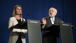 Iranian Foreign Minister Javad Zarif (R) delivers a statement, flanked by European Union High Representative for Foreign Affairs and Security Policy Federica Mogherini, at the Swiss Federal Institute of Technology in Lausanne (Ecole Polytechnique Federale De Lausanne) on April 2, 2015, after Iran nuclear program talks finished with extended sessions. European powers and Iran on April 2 hailed a breakthrough in talks on reaching a deal to curtail Tehran's nuclear programme. AFP PHOTO / POOL / BRENDAN SMIALOWSKIBRENDAN SMIALOWSKI/AFP/Getty Images