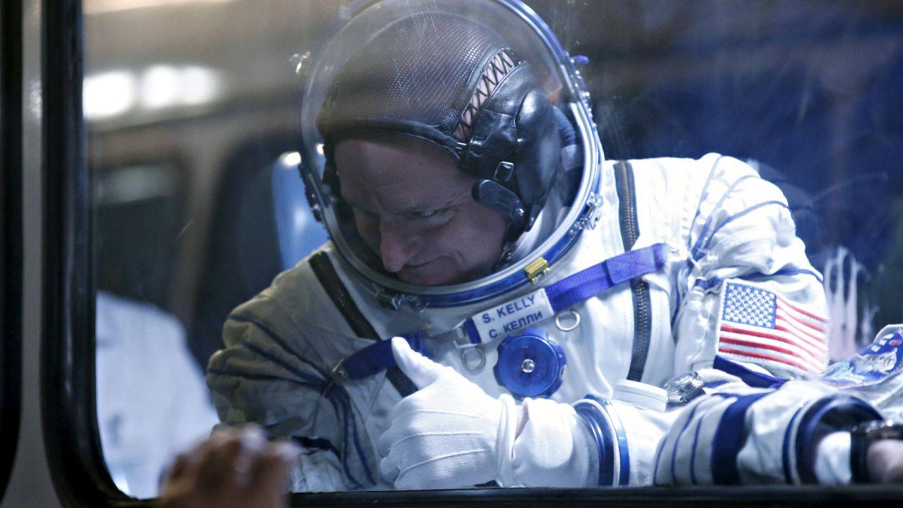 NASA astronaut Scott Kelly gives the thumbs-up after donning his spacesuit Friday, March 27, in Baikonur, Kazakhstan. Kelly and two Russian cosmonauts were <a href="http://www.cnn.com/2015/03/26/us/gallery/year-in-space/index.html" target="_blank">launched into space</a> for a stint aboard the International Space Station. 
