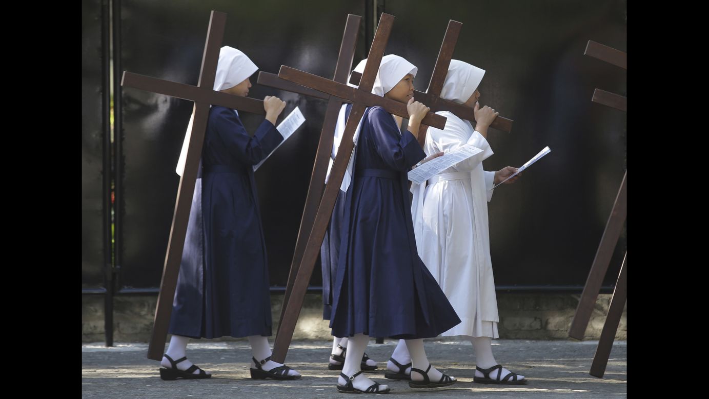 Nuns in Quezon City, Philippines, carry wooden crosses as they make a Stations of the Cross display on Wednesday, April 1. <a href="http://www.cnn.com/2015/03/30/living/gallery/holy-week-2015/index.html" target="_blank">See more photos from Holy Week</a>, which marks the last week of Lent and the beginning of Easter celebrations.