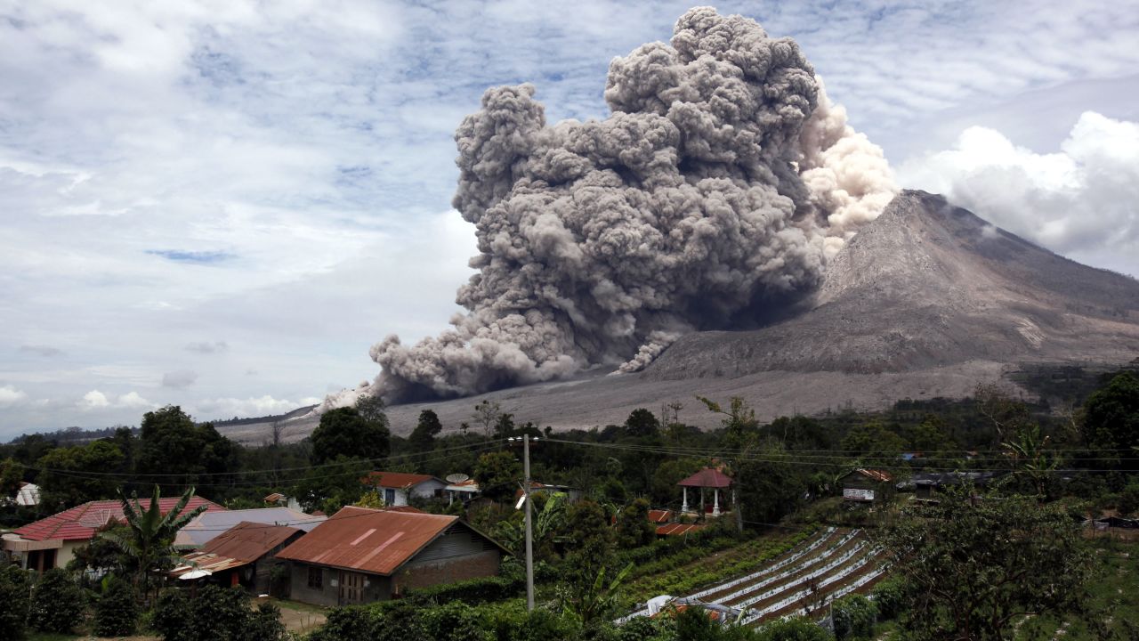 The Mount Sinabung volcano releases pyroclastic flows Wednesday, April 1, in North Sumatra, Indonesia. After being dormant for more than 400 years, Mount Sinabung has erupted sporadically since 2010.