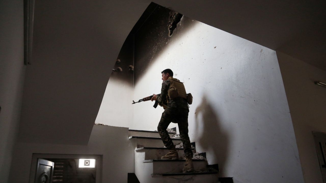 An Iraqi soldier searches for ISIS fighters in Tikrit, Iraq, on Monday, March 30. Tikrit had been under ISIS control since June, but <a href="http://www.cnn.com/2014/06/13/world/gallery/iraq-under-siege/index.html" target="_blank">Iraqi forces retook it</a> with the help of Shiite militiamen.