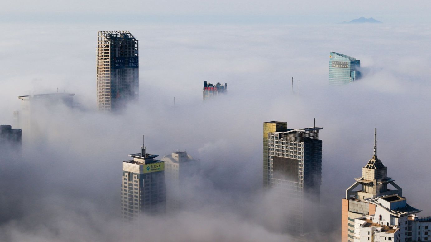 Heavy fog surrounds buildings in Qingdao, China, on Friday, March 27.