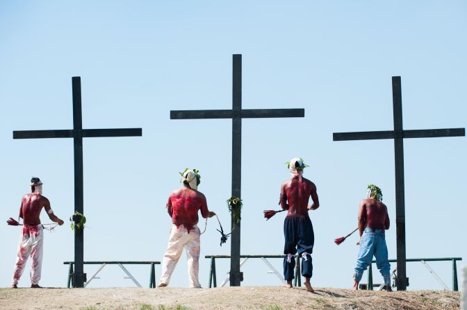 Penitents in San Pedro Cutud, Philippines, kneel in front of crosses while whipping their backs in a <a href="http://cnnphilippines.com/lifestyle/2015/04/03/Self-flagetllation-rituals-in-Santa-Lucia.html" target="_blank" target="_blank">self-flagellation ritual</a> on April 3.