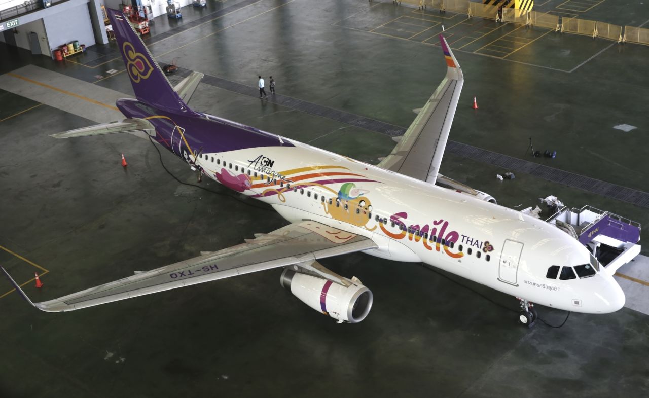 Airline Thai Smile has unveiled its new livery featuring "Adventure Time" stars Jake and Finn. The airline, a Thai Airways subsidiary, introduced the livery as part of a partnership with Cartoon Network Amazone, a water park based in the Thai resort city of Pattaya. Click on for more wild airline paint jobs. 
