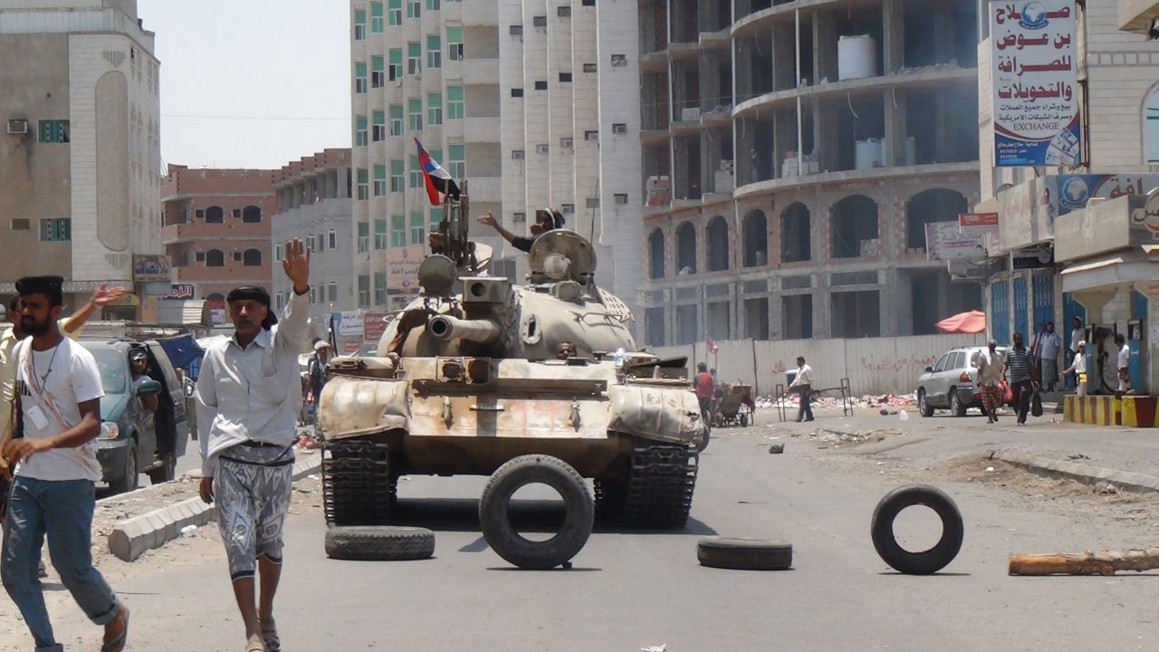 Militiamen loyal to Hadi take positions on a street in Aden, Yemen, on Thursday, April 2. Houthi rebels seized the presidential palace in Aden, a neutral security official and two Houthi commanders in Aden told CNN. The Houthis are Shiite Muslims who have long felt marginalized in the majority Sunni country. The Sunni Saudis consider the Houthis proxies for the Shiite government of Iran and fear another Shiite-dominated state in the region.