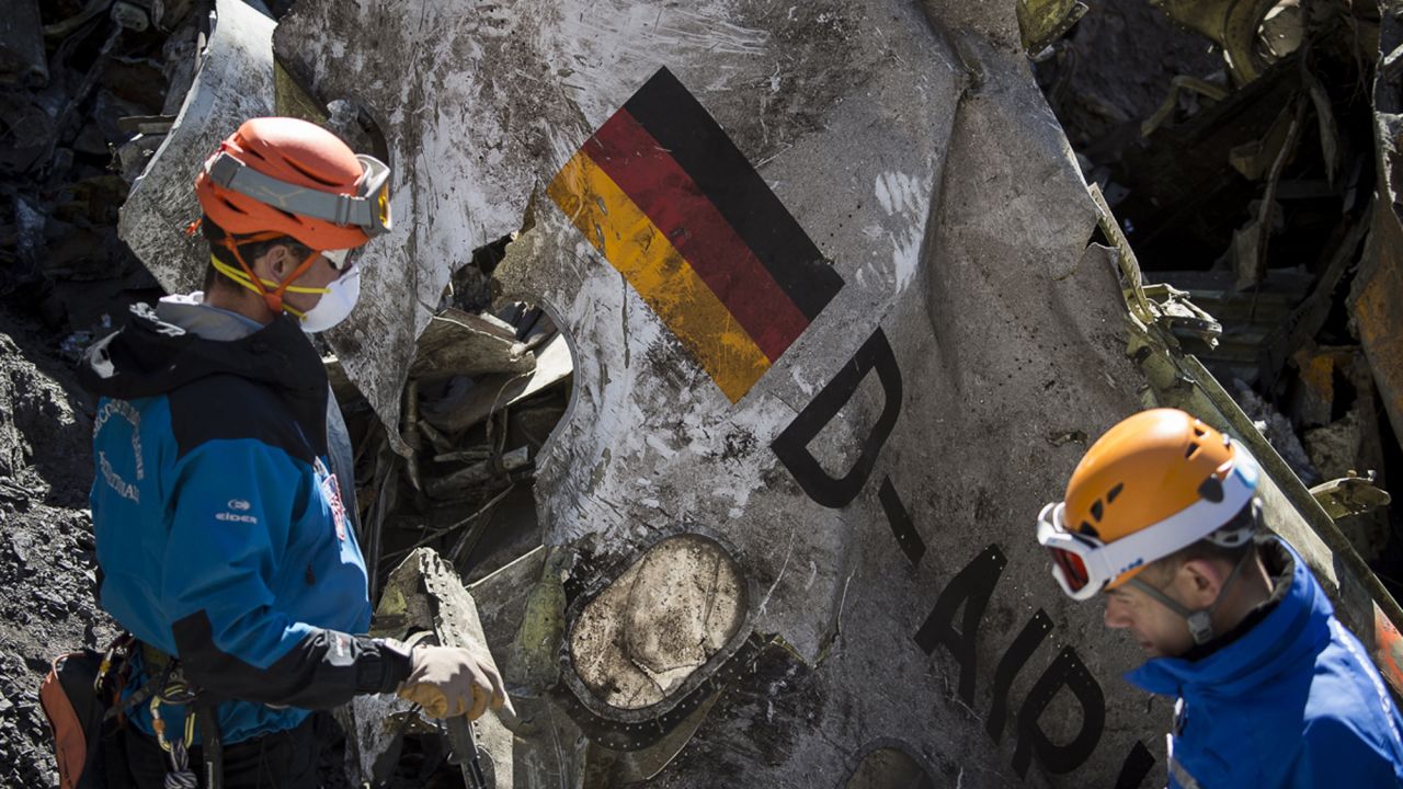 Rescue workers recover debris from the crash site in the French Alps on Tuesday, March 31. Flight 9525 was traveling from Barcelona, Spain, to Dusseldorf, Germany, when it crashed.