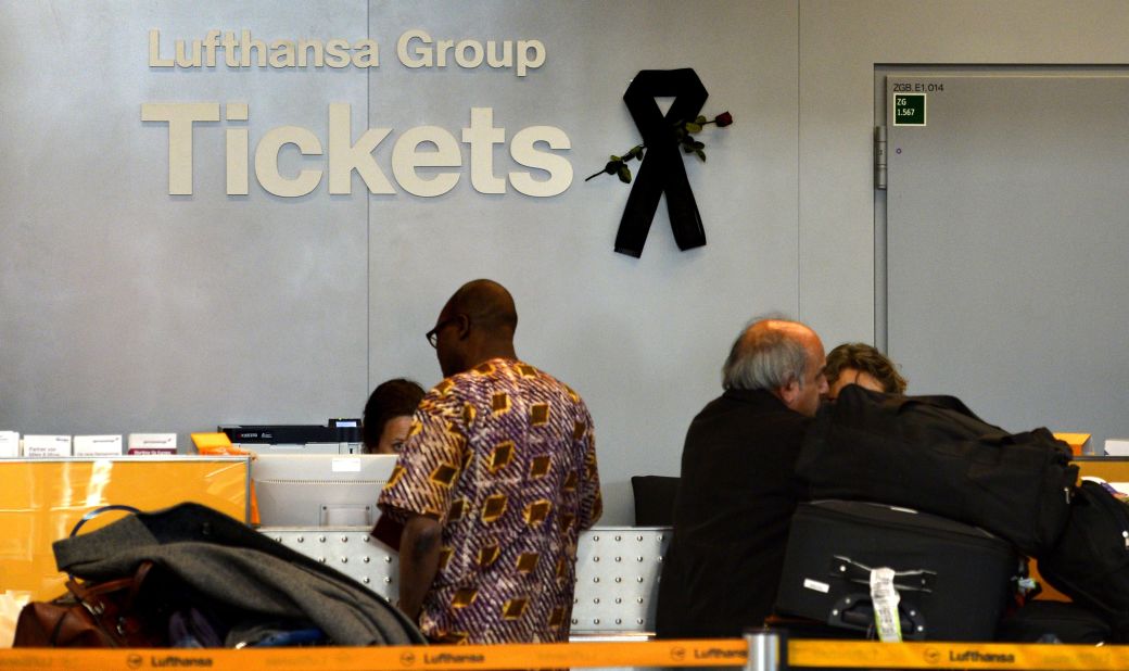 A black mourning band is seen at a ticket counter for German airline Lufthansa at the airport in Dusseldorf, Germany, on Tuesday, March 31.