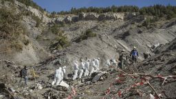 French emergency rescue services work among debris of the Germanwings passenger jet at the crash site near Seyne-les-Alpes, France on Friday, April 3.