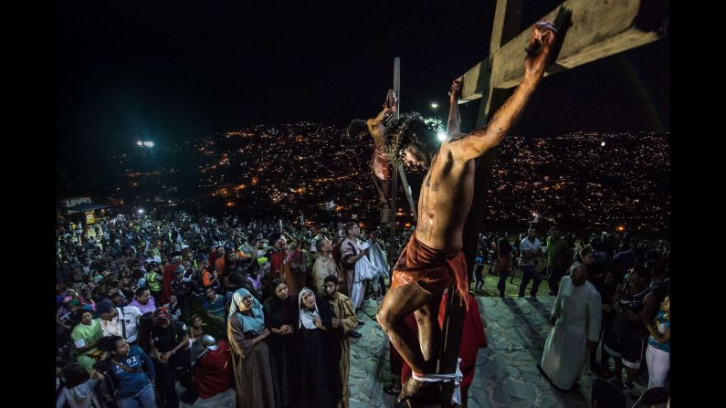 A Catholic devotee portrays Jesus Christ during a re-enactment of the crucifixion in the Petare shantytown in Caracas on Friday, April 3. 