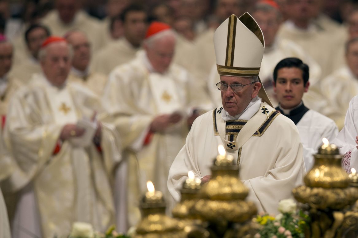 Pope Francis celebrates an Easter vigil service in St. Peter's Basilica.