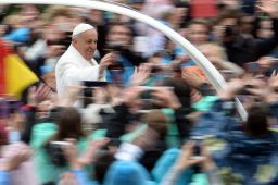 Pope Francis greets the crowd from the popemobile after the Easter Mass on Sunday at the Vatican.