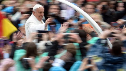 Pope Francis greets the crowd from the popemobile after the Easter Mass on Sunday at the Vatican.