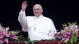 Pope Francis waves to the faithful as he delivers his 'Urbi et Orbi' blessing message from the central balcony of St Peter's Basilica at the end of the Easter Mass on April 5 in Vatican City, Vatican.