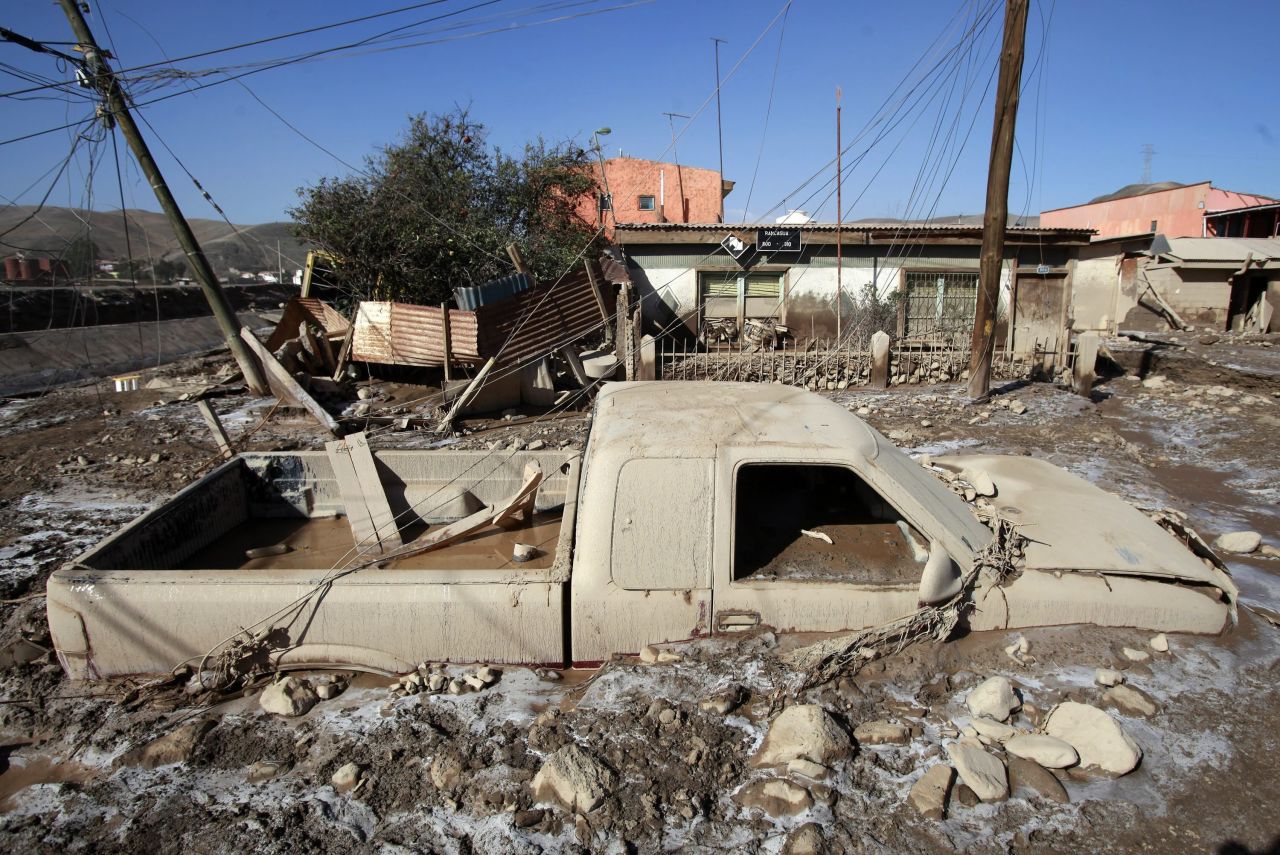 A pickup truck sits encased in mud in Diego de Almagro on March 28. 