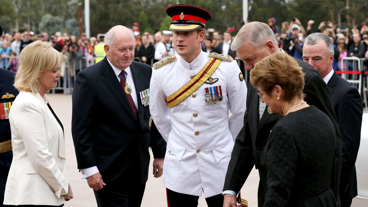 Prince Harry  is greeted by Governor-general Sir Peter Cosgrove  and Chairman of the Council of the War Memorial Ken Doolan  during a visit to the Australian War Memorial on April 6, 2015 in Canberra, Australia. Prince Harry, or Captain Wales as he is known in the British Army, will end his military career with a month long secondment to the Australian Defence Force in barracks in Sydney, Perth and Darwin.