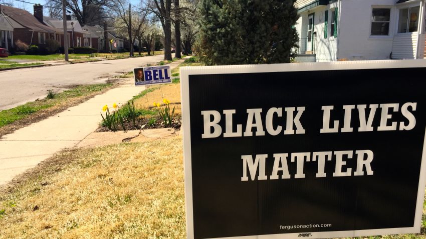 Wesley Bell's sign shares space with a common slogan in Ferguson.