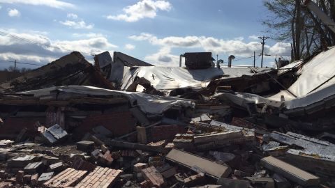 Burned out buildings remain as scars of vandalism and arson that occurred during protests in November.