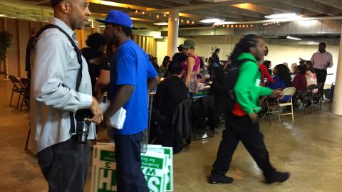 Supporters of candidate Lee Smith bring yard signs to an Easter/Passover dinner at Greater St. Mark Family Church.
