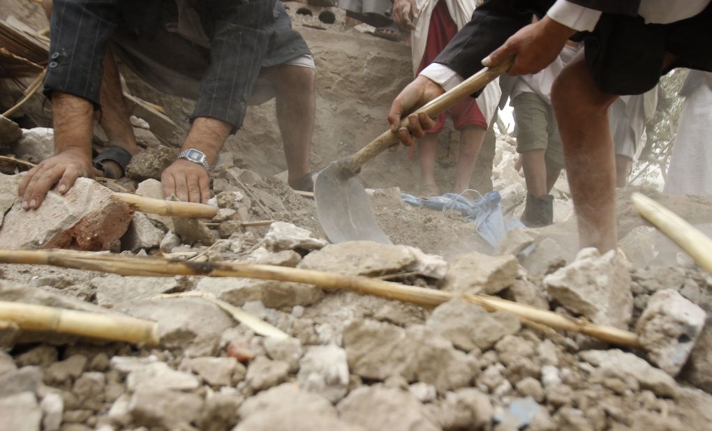 Yemenis search for survivors in the rubble of houses destroyed by Saudi-led airstrikes on April 4 in a village near Sanaa.