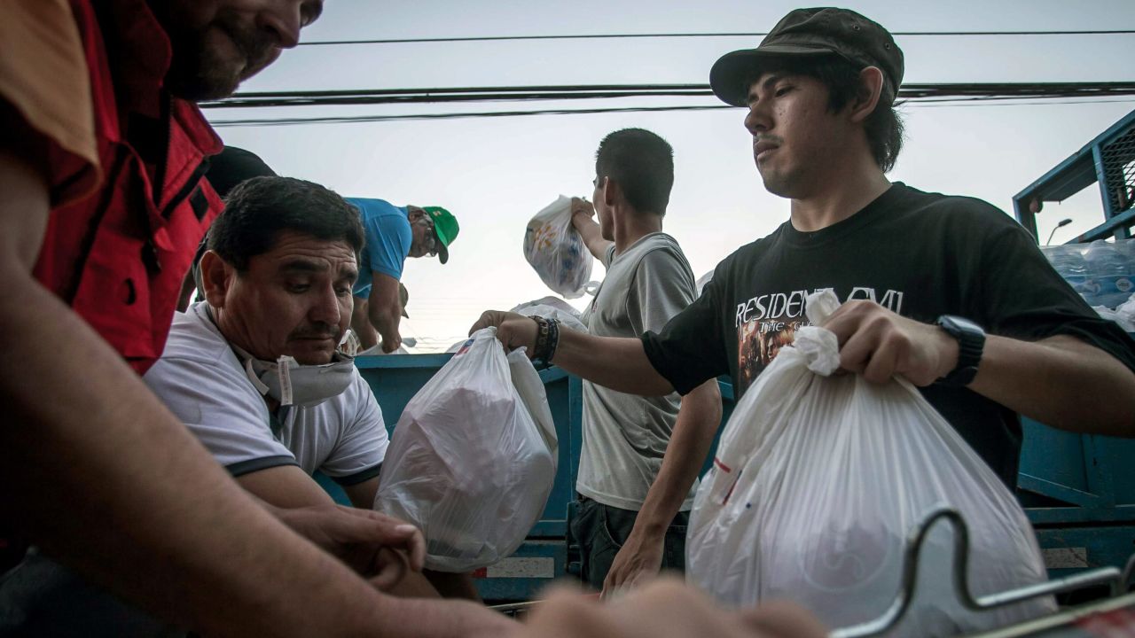 Volunteers distribute bags at a relief center in Copiapo on Wednesday, April 1.