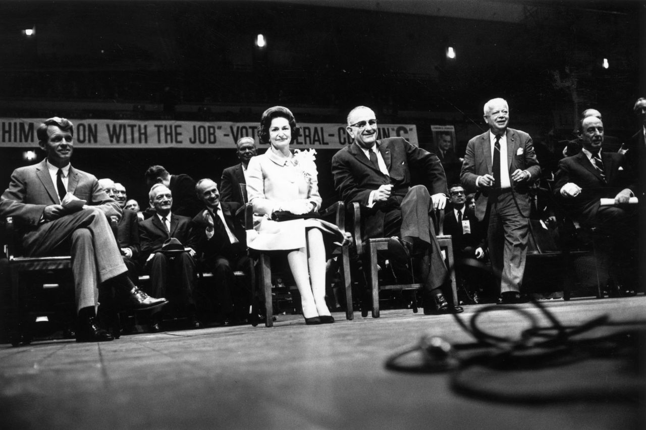 Sen. Robert Kennedy, Lady Bird Johnson and President Lyndon Johnson attend an election rally on November 3, 1964, at Madison Square Garden in New York. Johnson's slogan was, "The Stakes are Too High for You to Stay at Home."