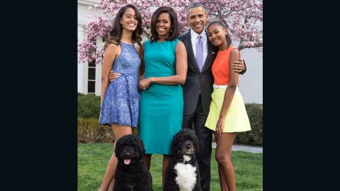 President Barack Obama is pictured with first lady Michelle and their daughters Malia, 16, (left) and Sasha, 13, (right).