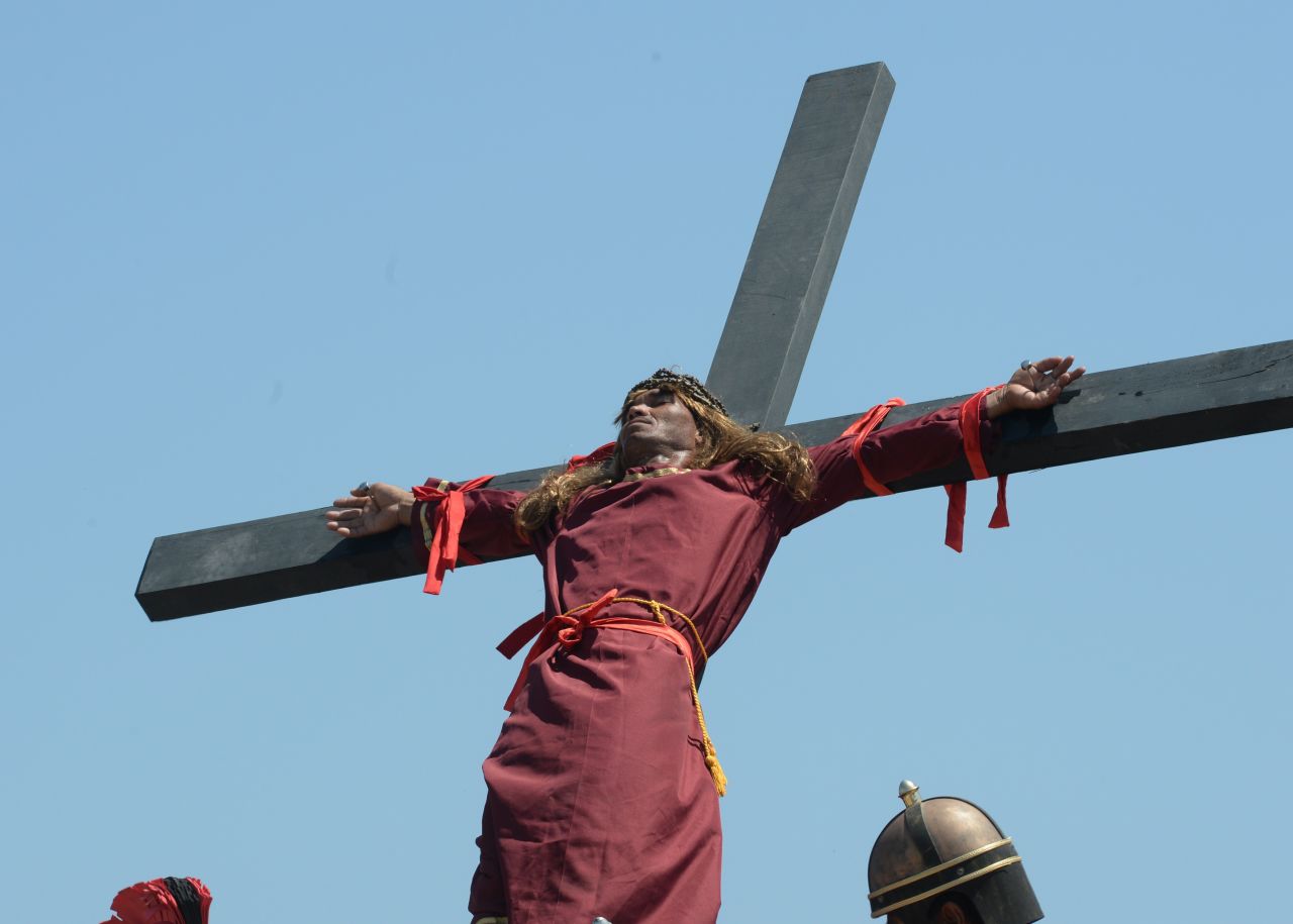 A penitent is nailed to a cross on April 3, 2015.