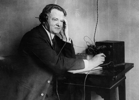 Herbert Hoover listens to a one-valve radio set circa 1928. Hoover's campaign slogan in 1928 was, "A chicken in every pot and a car in every garage."