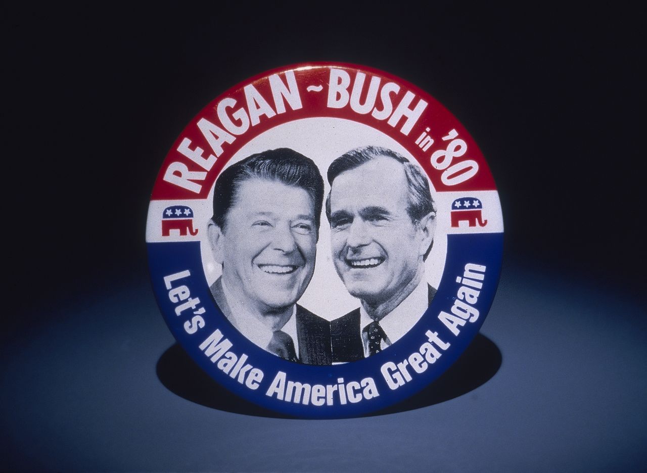 A 1980 campaign button features Reagan and his running mate, George H. W. Bush.