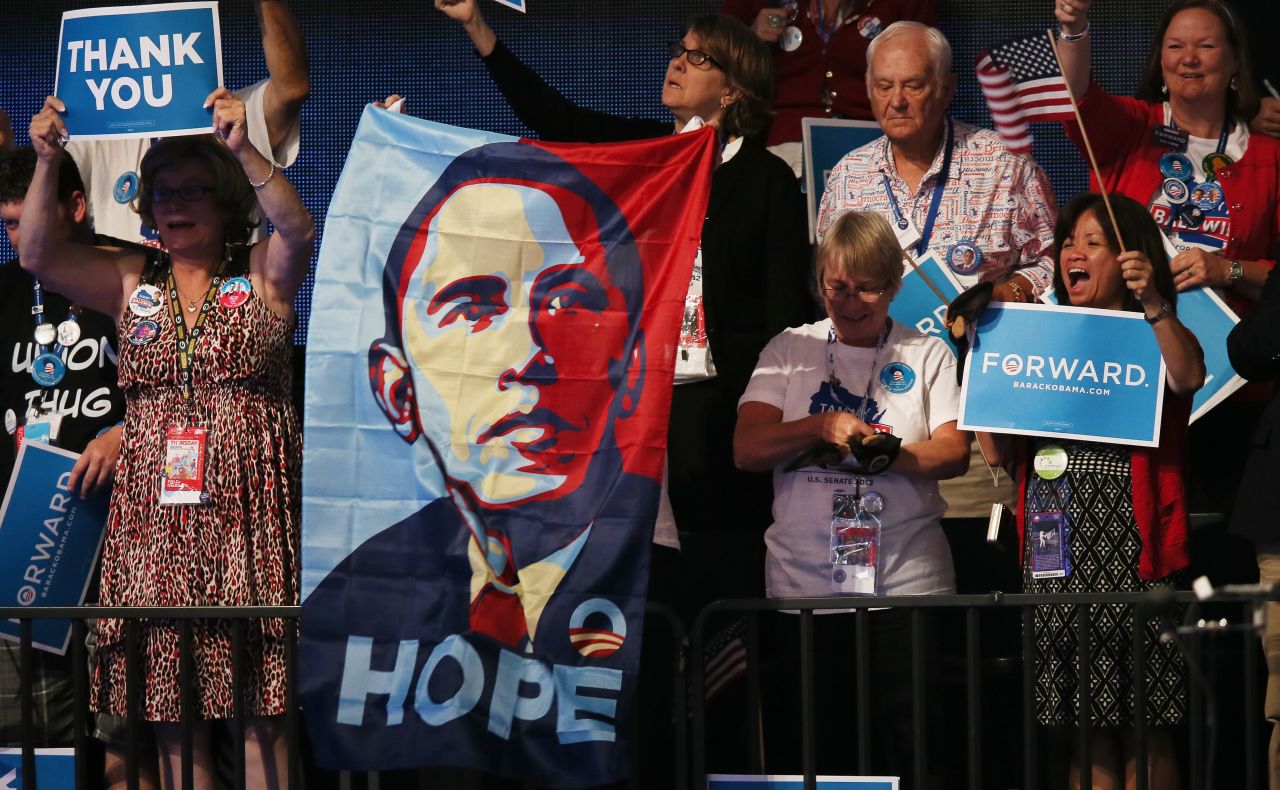 People cheer as Obama speaks on stage as he accepts the nomination for president on September 6, 2012, in Charlotte, North Carolina. After his successful "Hope and Change" 2008 campaign, Obama ran for reelection on the slogan "Forward."