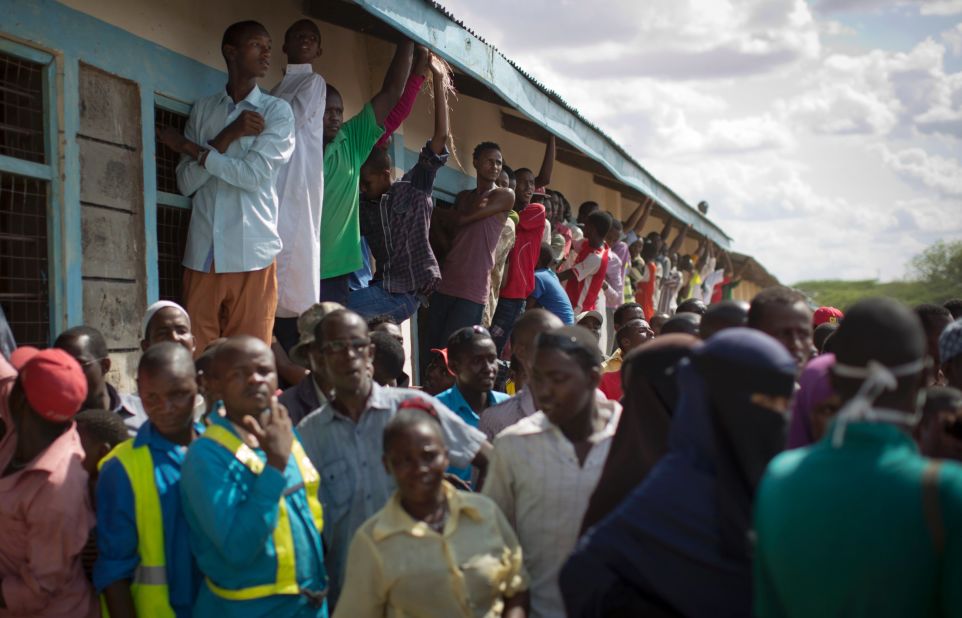 Members of the public view the bodies of the alleged attackers on April 4, 2015.