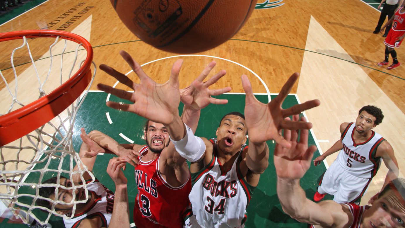 Milwaukee's Giannis Antetokounmpo (No. 34) reaches for a rebound while playing the Chicago Bulls in an NBA game Wednesday, April 1, in Milwaukee.