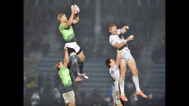 South Africa's Kyle Brown catches the rugby ball while playing England in the final of the Tokyo Sevens on Sunday, April 5. England won the match 21-14.