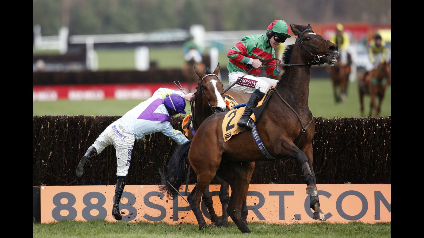 Brian Hughes falls off Sergeant Pink during a race in Haydock, England, on Saturday, April 4.
