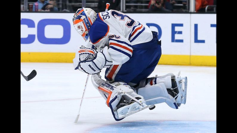 Edmonton goalie Ben Scrivens hops as he makes a save in Los Angeles on Thursday, April 2.