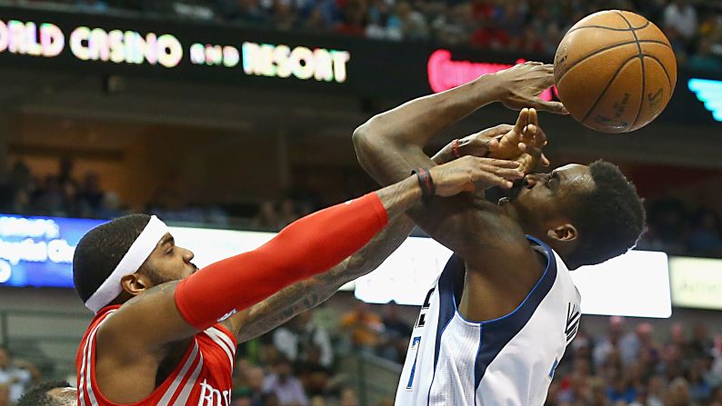 Dallas' Al-Farouq Aminu is fouled by Houston's Josh Smith during an NBA game in Dallas on Thursday, April 2.